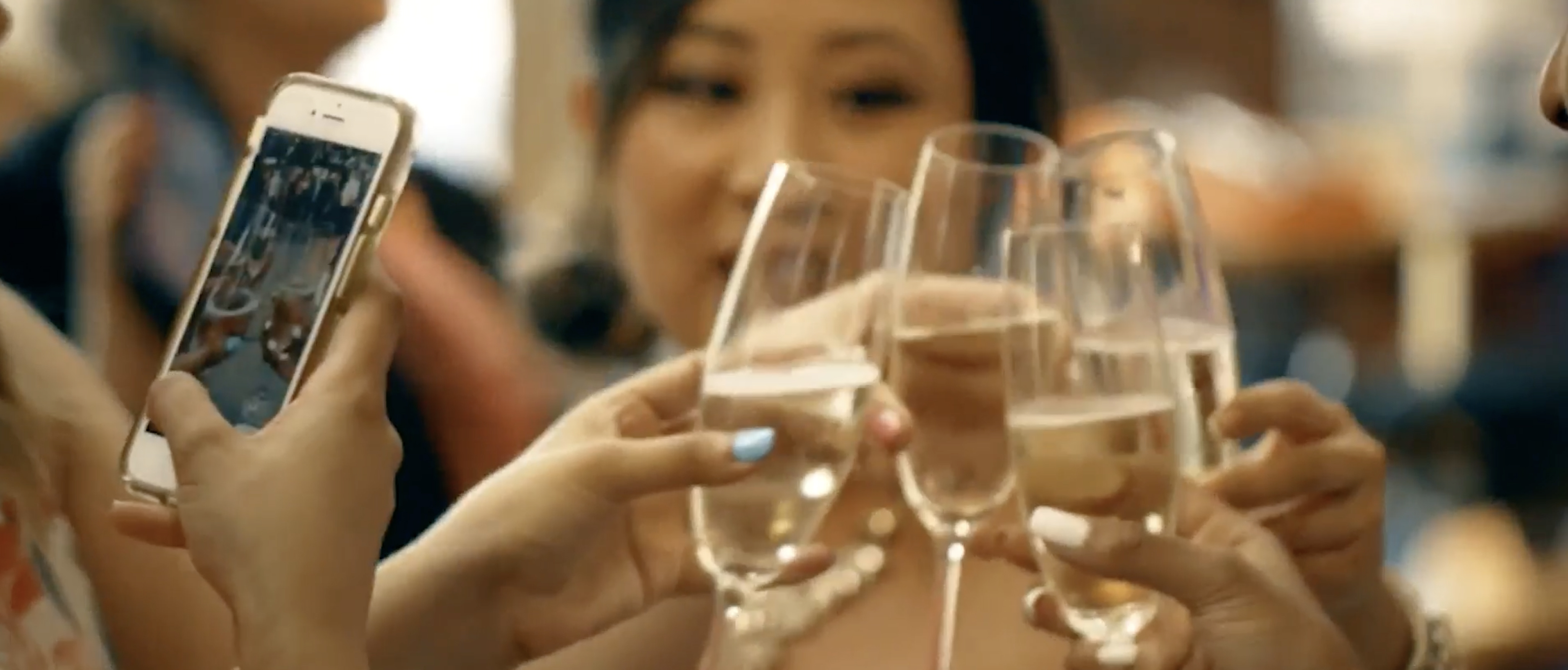 Guests raising champagne glasses in a toast at Scrubs.